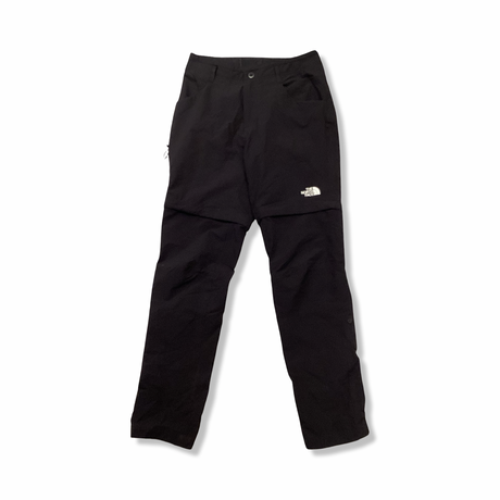 Svart underställsbyxa från The North Face för dam, fotograferad framifrån mot en vit bakgrund.