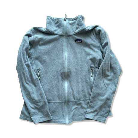 Gray Patagonia fleece cardigan with a zipper and high collar against a white background.