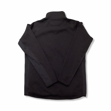 Back view of a black Patagonia men's fleece cardigan against a white background.