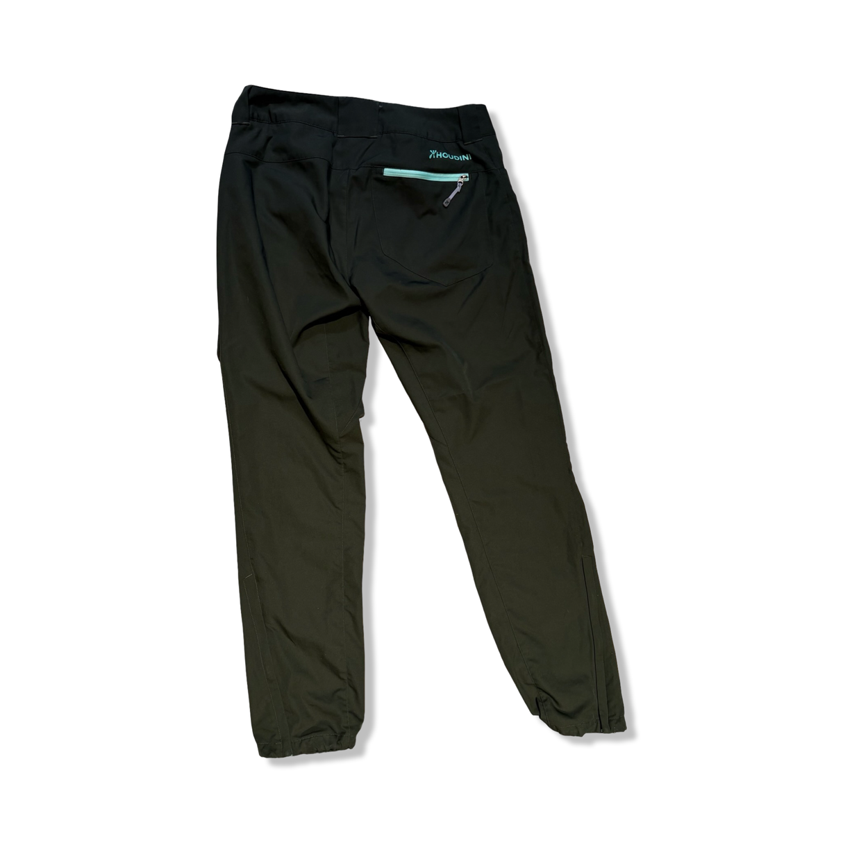 Back of green Houdini women's hiking trousers with a zippered pocket, shown against a white background.