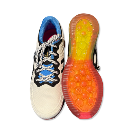 White Asics Gel-Quantum Infinity women's training shoes with colorful soles, photographed from above against a white background.