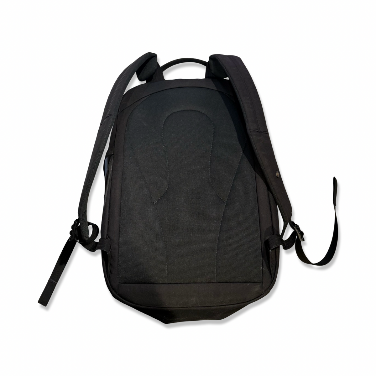 Black Lundhags 20L backpack with padded shoulder straps, back view against a white background.