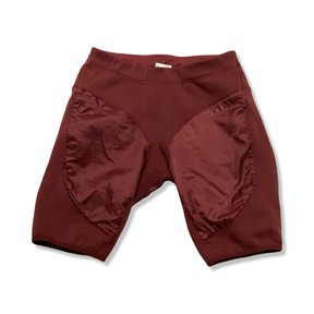 Rust brown Houdini women's base layer pants, front view against a white background.