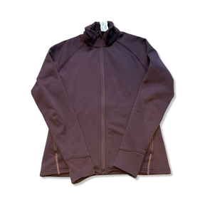 Mörkbrun Houdini Power Jacket i dammodell i storlek M, fotograferad framifrån mot en vit bakgrund.