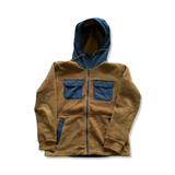 Mustard yellow men's fleece cardigan from Vaude with a hood and dark blue chest pockets, photographed against a white background.
