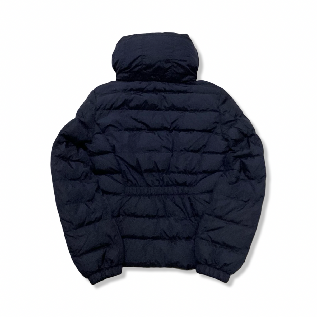 Baksidan av en blå dunjacka från Moncler för barn i storlek 14Y, fotograferad mot en vit bakgrund.