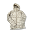Beige dunjacka från Haglöfs för dam med huva och kviltad design, fotograferad framifrån mot en vit bakgrund.