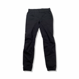 Black Ortovox women's pants with an elastic waistband, front view against a white background.