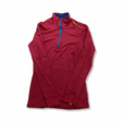Pink Ortovox women's thermal top with a zipper, front view against a white background.