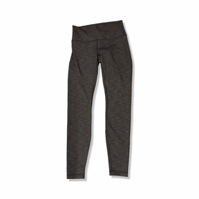 Grå träningstights från Lululemon i dammodell, fotograferade framifrån mot en vit bakgrund.