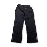 Back view of a pair of black Marmot women's shell pants against a white background.