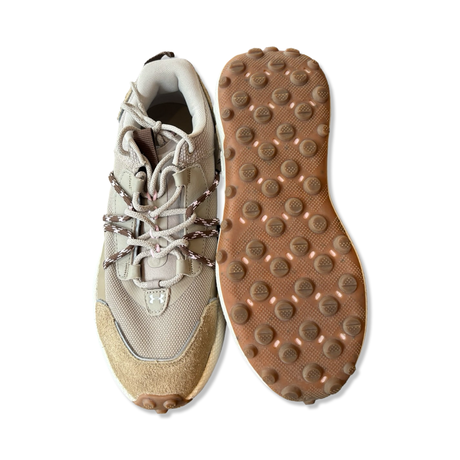 Beige Under Armour Fat Tire Venture Pro men's sneakers shown from above focusing on the upper and sole against a white background.