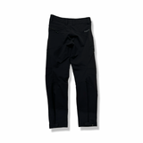 Back view of a pair of black Norröna svalbard flex pants for women against a white background.