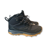 Black Salomon Outsnap CSWP hiking boot with a brown sole and laces, photographed against a white background.
