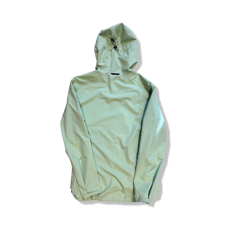Green Peak Performance women's shell jacket in size L with a hood, back view against a white background.