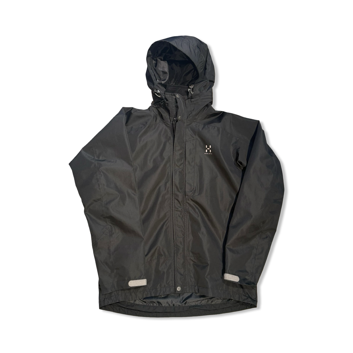 Black Haglgfs women's hooded shell jacket, front view against a white background.