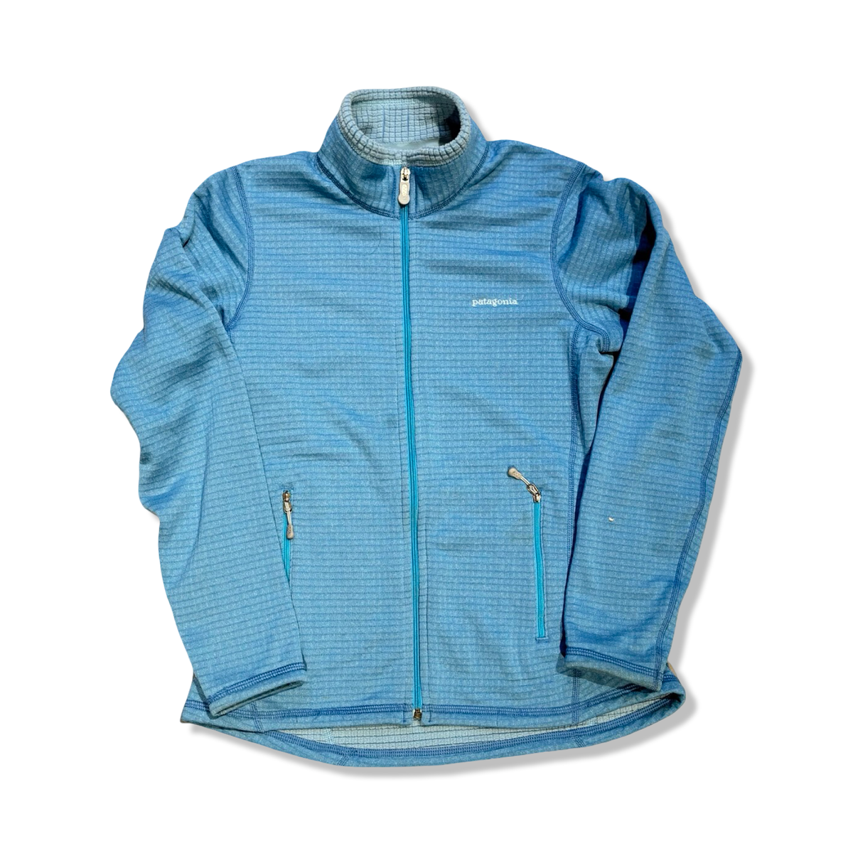 Light blue women's fleece cardigan from Patagonia with a zipper, photographed from the front against a white background.
