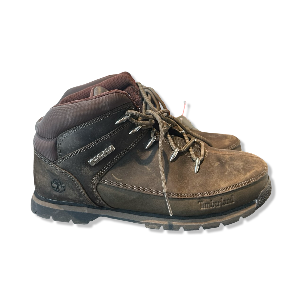 Brown women's hiking boots from Timberland with lacing, photographed from the side against a white background.