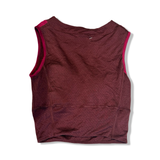 Red Icebreaker women's training top, shown from the back against a white background.