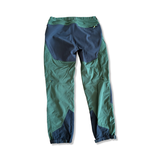 Men's Haglöfs Rugged Mountain hiking pants in green and black, back view against a white background.