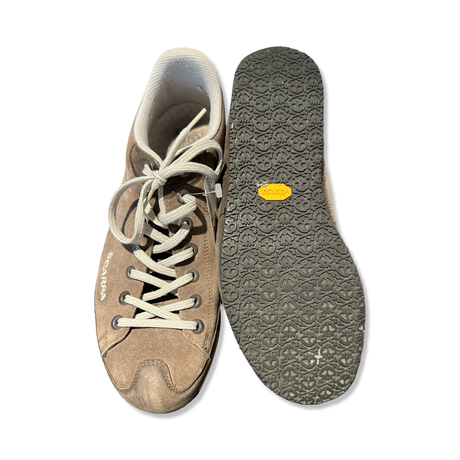 Brown Scarpa men's sneakers with light laces and a treaded outsole, shown from the front with the sole facing a white background.