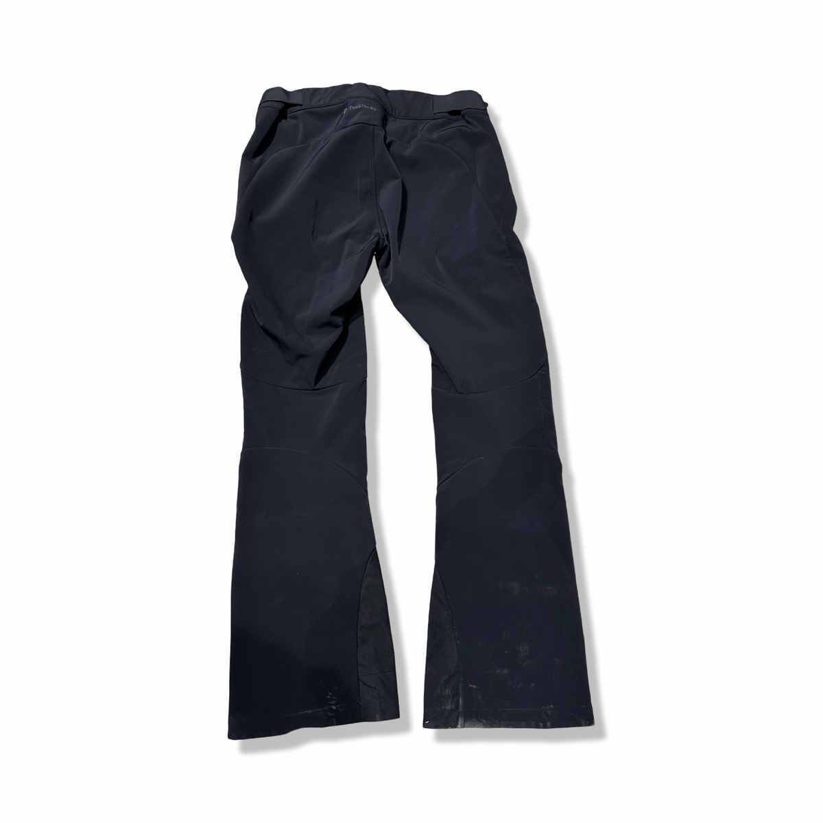 Back view of a pair of black Peak Performance women's ski pants against a white background.