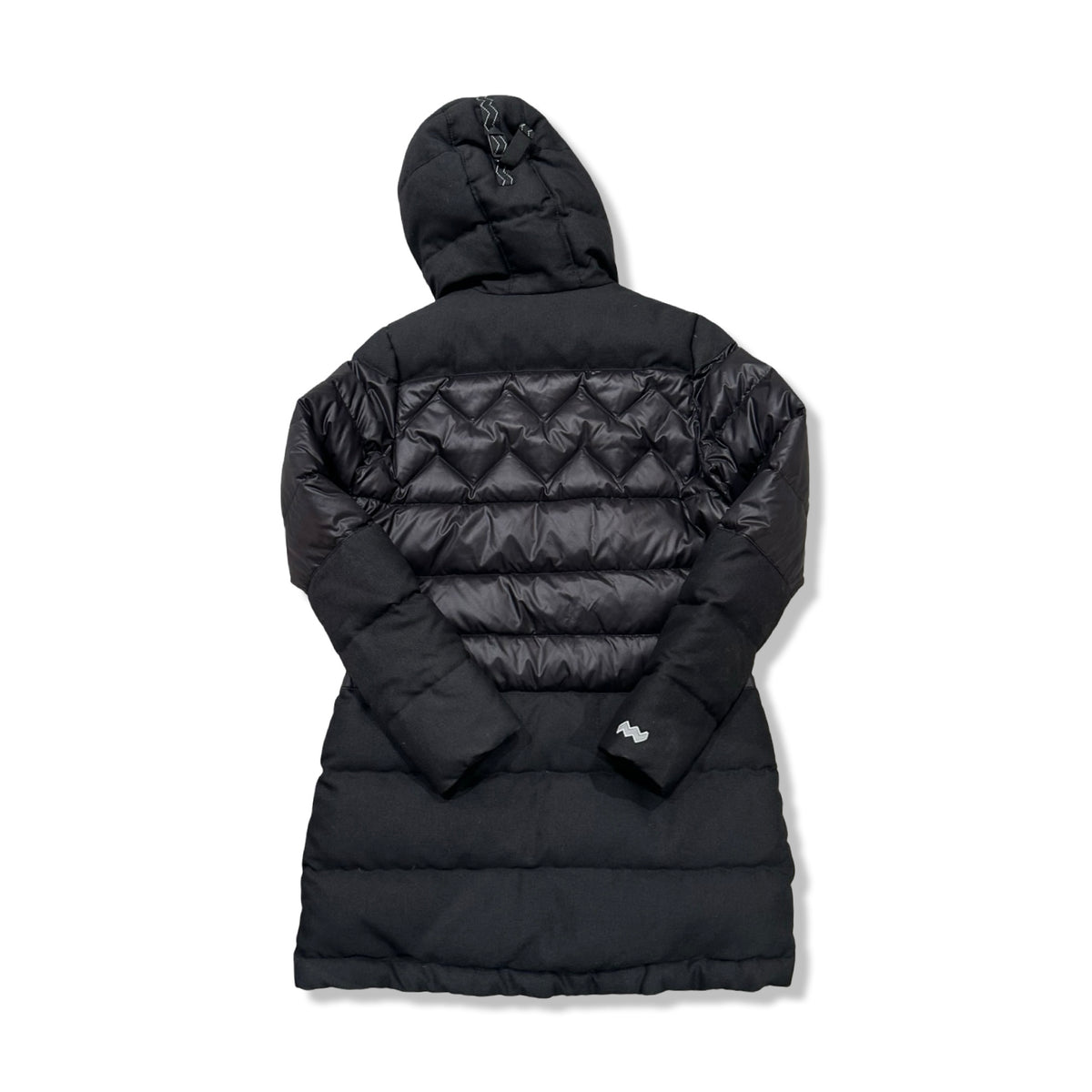 Back view of a black Mountain Works women's hooded puffer jacket against a white background.