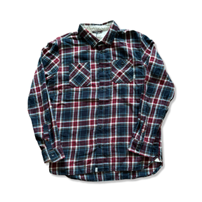 Blue and red plaid Vans men's flannel shirt with chest pockets and button-up closure, photographed against a white background.