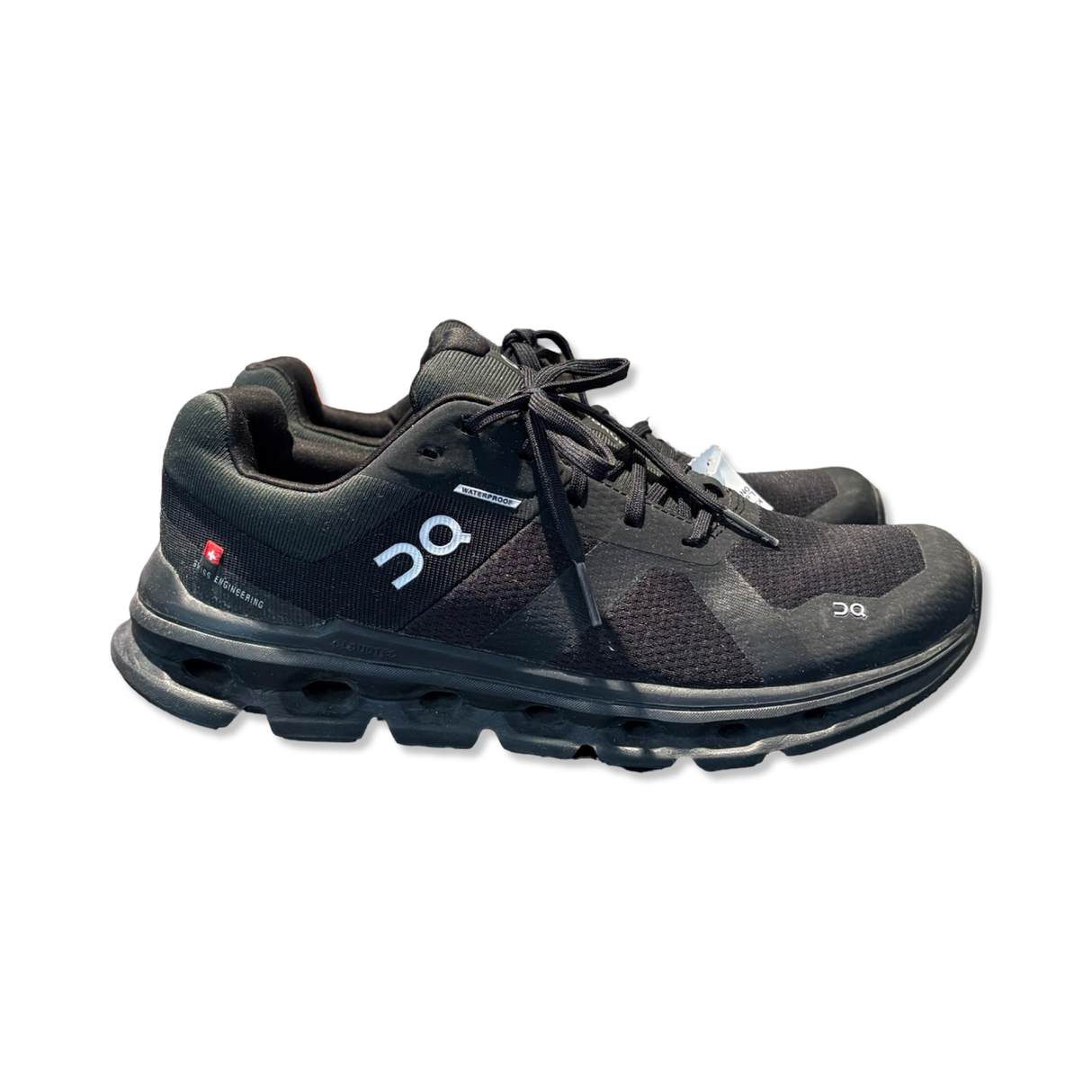 Black men's running shoe from ON, model Cloudrunner, photographed in profile against a white background.
