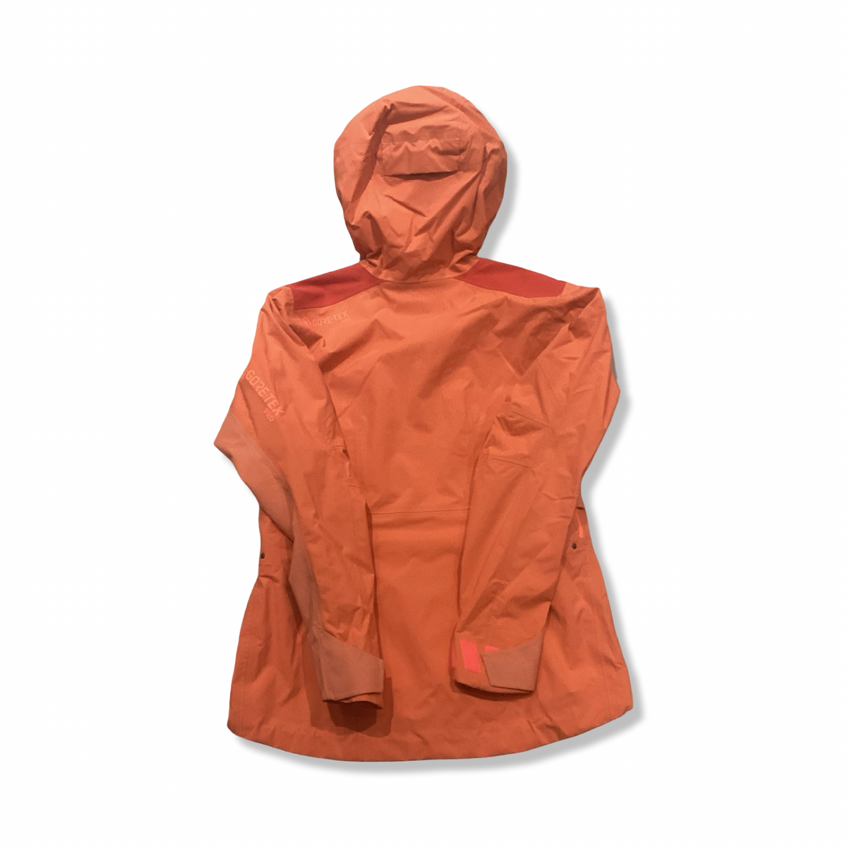Back view of an orange women's Gore-Tex Pro hooded shell jacket against a white background.