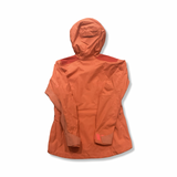 Back view of an orange women's Gore-Tex Pro hooded shell jacket against a white background.