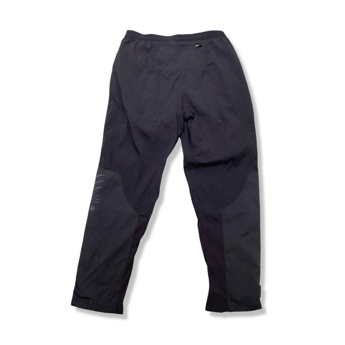 Back view of a pair of black Nike women's athletic pants against a white background.