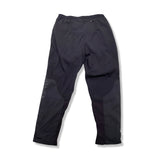 Back view of a pair of black Nike women's athletic pants against a white background.
