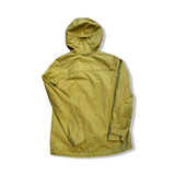 Back view of a green Bergans Nordmarka Leaf Light Wind Jacket women's shell jacket against a white background.