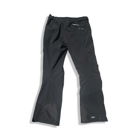 Back view of a black Peak Performance women's ski pants against a white background.