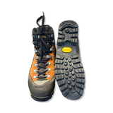 Meindl Air Revolution 3.1 hiking boots in orange velour leather with a Vibram sole, front and bottom view.