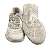 White Puma Varion II women's training shoes with lacing and a patterned outsole, shown from the front and with the sole facing upwards against a white background.