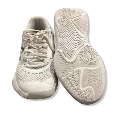 White Puma Varion II women's training shoes with lacing and a patterned outsole, shown from the front and with the sole facing upwards against a white background.