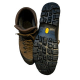 Men's brown leather Scarpa GTX hiking boots, featuring a top-down view of one shoe and the textured rubber sole of the other.