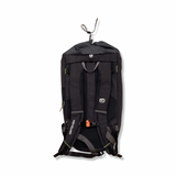 Back view of a black Ortovox Trad Zero 24 climbing backpack with shoulder straps against a white background.