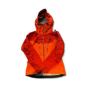 Women's orange Arc'teryx Alpha AR Gore-Tex Pro shell jacket, front view against a white background.