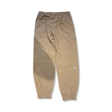 Women's SOS Fujiyama functional trousers in beige, back view against a white background.