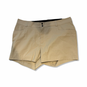 Peak Performance hiking shorts in beige, front view against a white background.