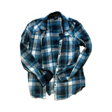 Women's Elevenate shirt in a blue plaid pattern, front view against a white background.