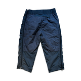 Men's blue Bergans Stranda Hybrid 3/4 functional pants, back view against a white background.