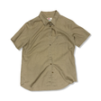 Beige Fjällräven-skjorta för dam med korta ärmar, krage, knäppning och bröstficka.