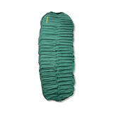 Green self-inflating Thermarest Trail Pro camping sleeping pad, top view against a white background.
