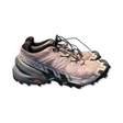 Purple Salomon women's running shoes with a Contagrip sole, side view against a white background.