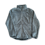 The North Face women's soft grey fleece jacket with a full zipper, front view against a white background.