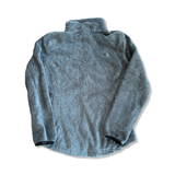 Women's grey The North Face fuzzy fleece sweater, back view against a white background.